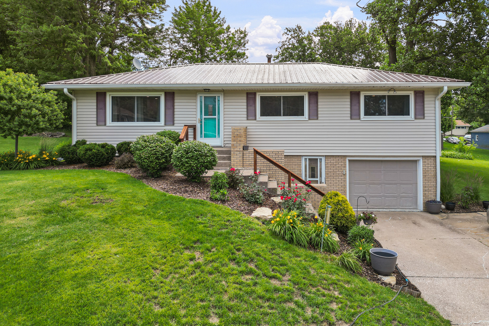 506 Bush Street Reynolds, IL 61279 - Photo 1 of 37 a front view of a house with garden