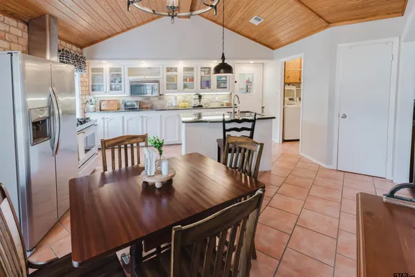 a dining room with furniture and window