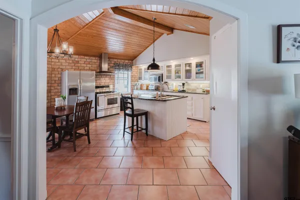 a kitchen with stainless steel appliances granite countertop a sink and cabinets