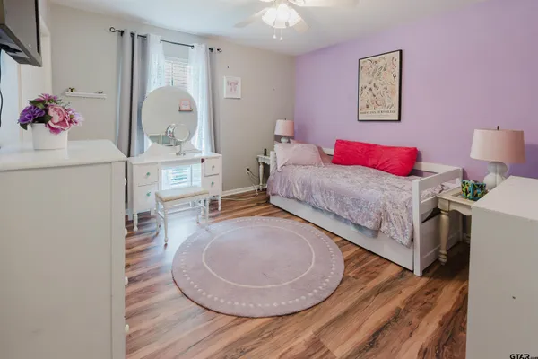 a bedroom with a bed and a dresser