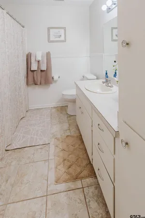 a bathroom with a double vanity sink and mirror