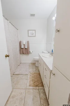 a bathroom with a double vanity sink and mirror