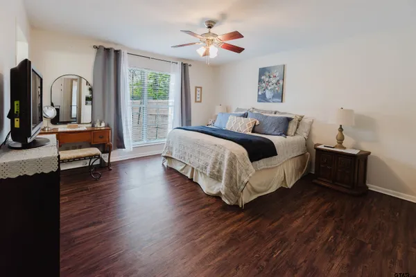 a bed room with bed and window