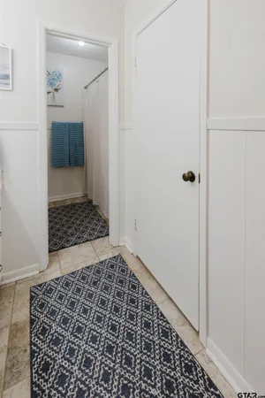 a view of a door and an empty room