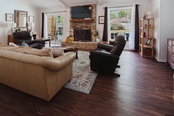 a living room with furniture and a fireplace