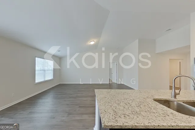 a view of a kitchen counter space and a sink