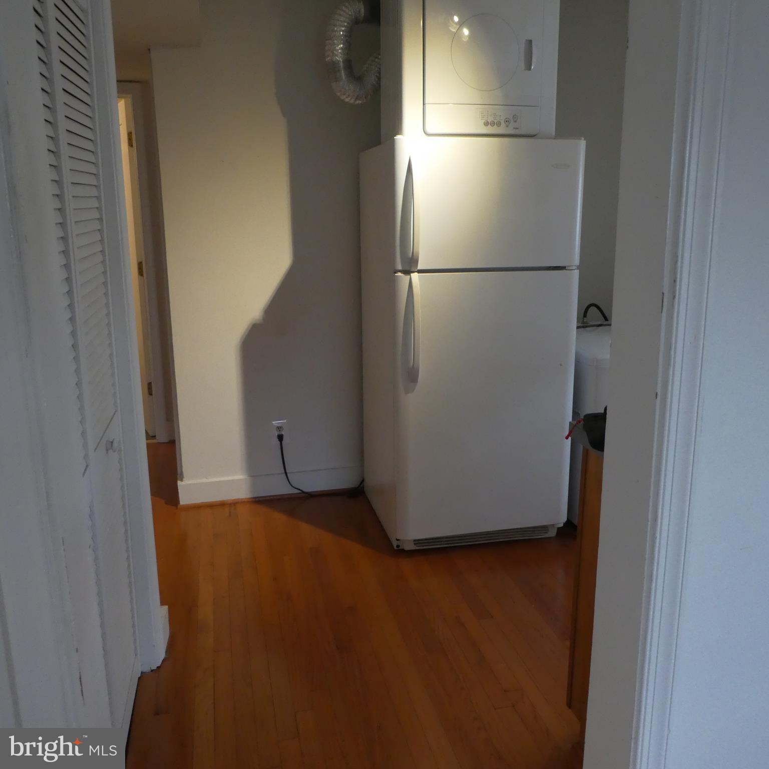 408 C Street, Unit 202 Quantico, VA 22134 - Photo 14 of 23 a view of a refrigerator in kitchen and an empty room