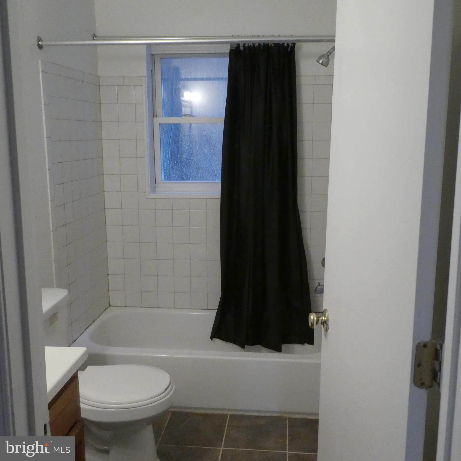 408 C Street, Unit 202 Quantico, VA 22134 - Photo 17 of 23 a bathroom with a toilet and a shower