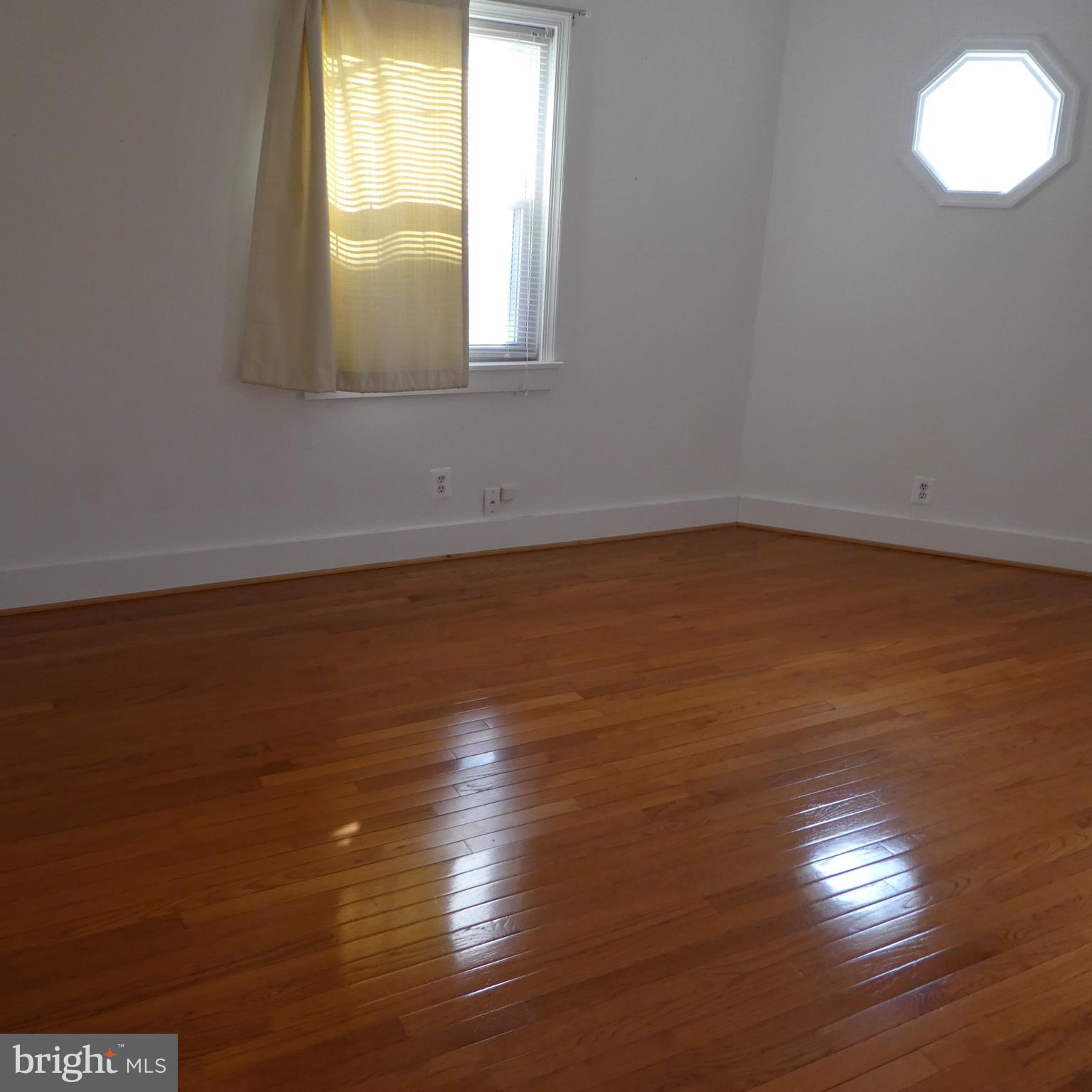408 C Street, Unit 202 Quantico, VA 22134 - Photo 9 of 23 a view of empty room with wooden floor and fan