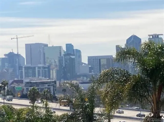 a view of a city with tall buildings
