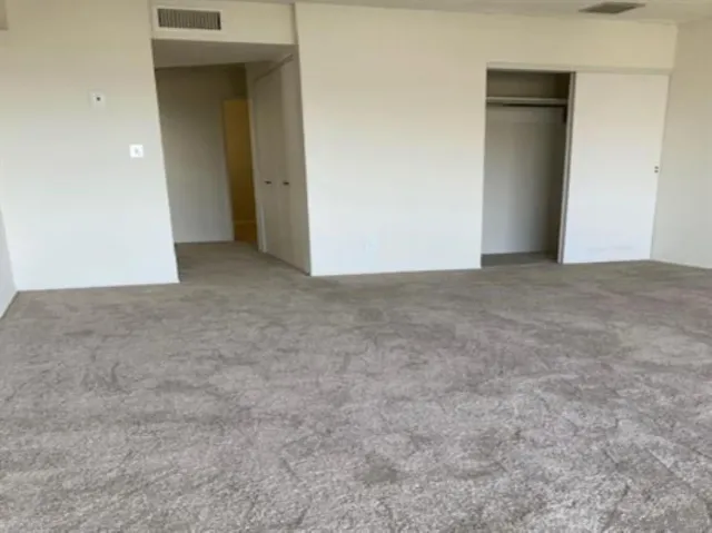 a view of a glass door and a balcony