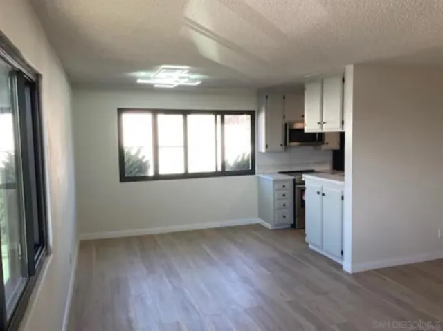 a kitchen with a stove and a refrigerator