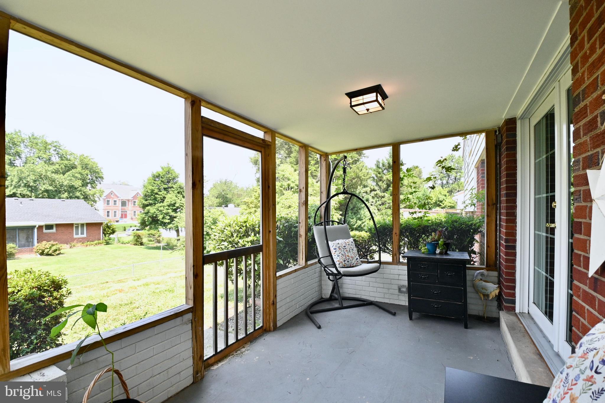 5010 Ravensworth Road Annandale, VA 22003 - Photo 34 of 42 Screened in patio off of the dining room