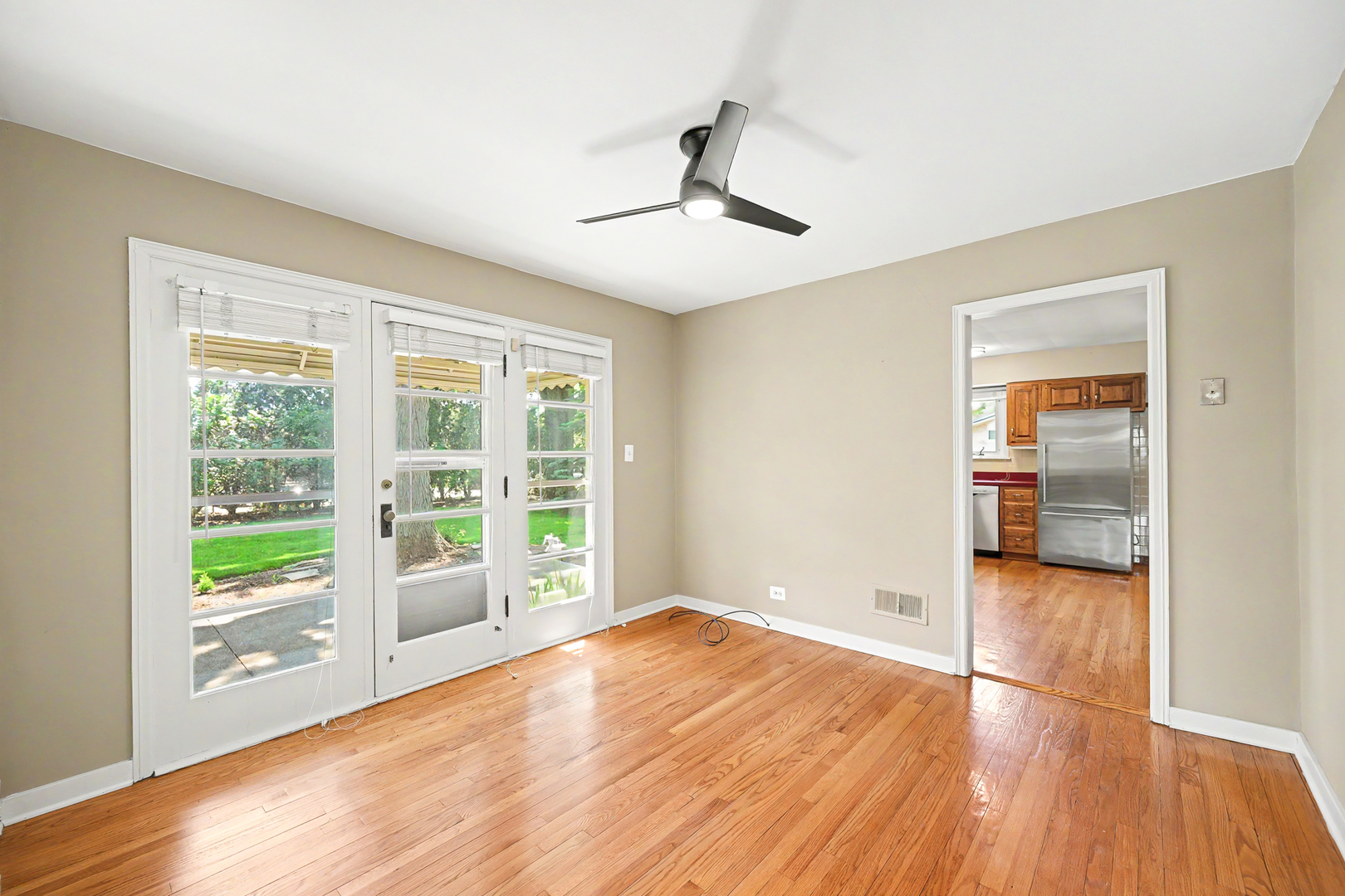325 South Lambert Road Glen Ellyn, IL 60137 - Photo 17 of 32 a view of empty room with wooden floor and fan