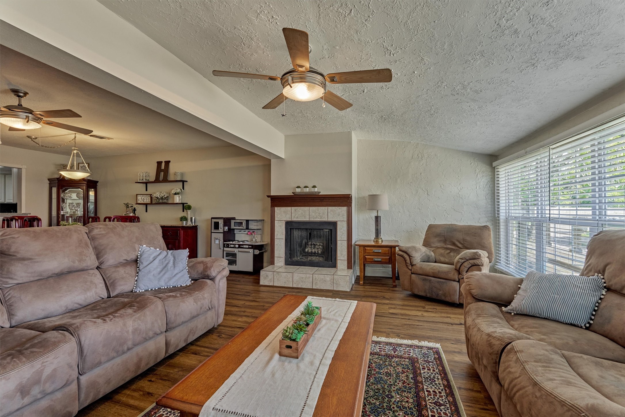 39 Regency Point Conroe, TX 77356 - Photo 17 of 44 a living room with furniture and a fireplace