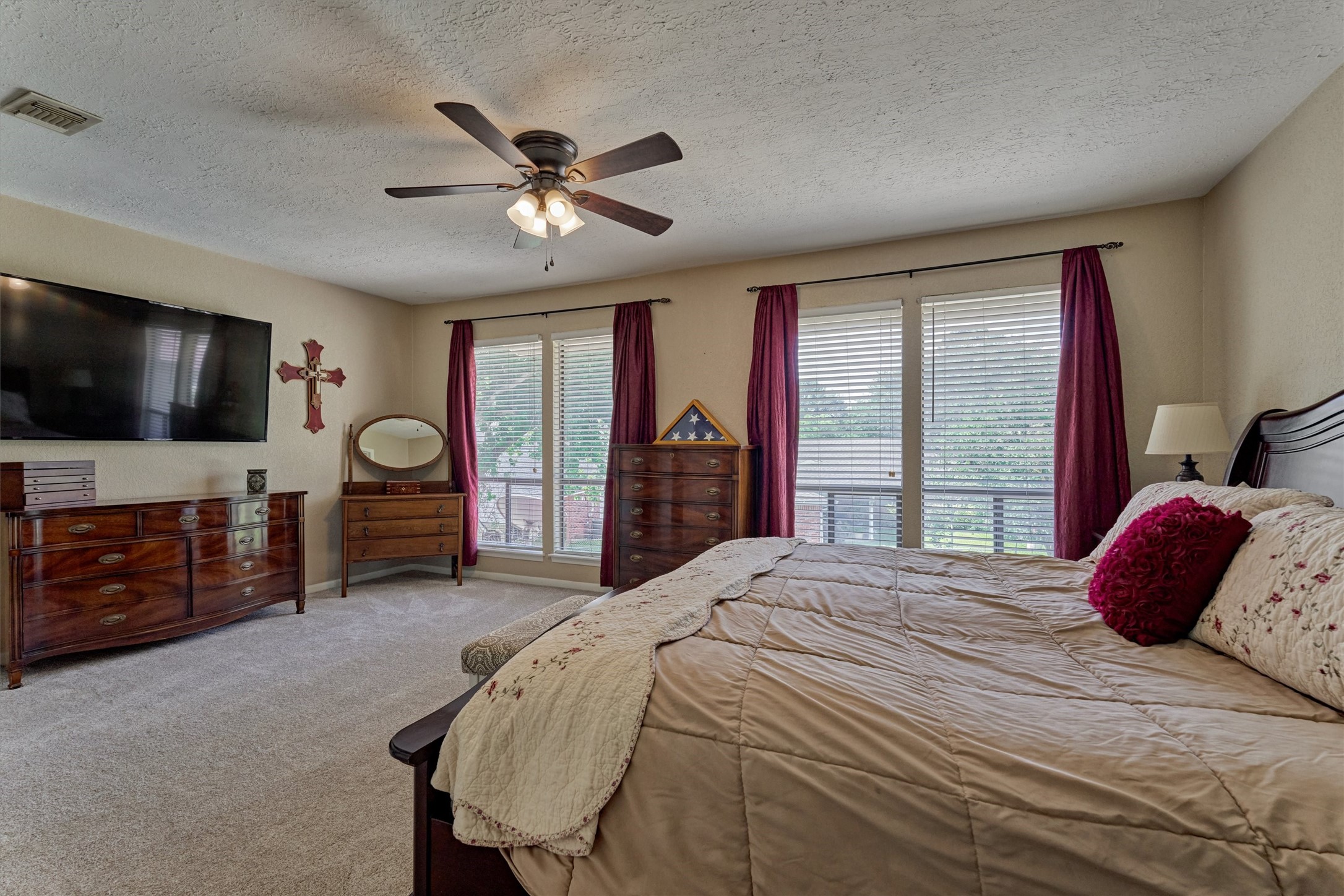 39 Regency Point Conroe, TX 77356 - Photo 26 of 44 a bedroom with a bed and a flat screen tv