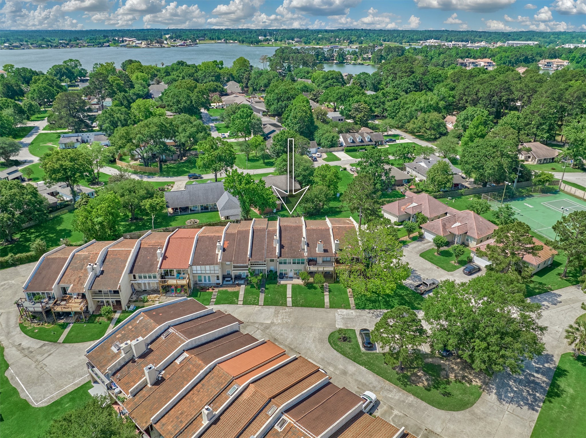 39 Regency Point Conroe, TX 77356 - Photo 37 of 44 an aerial view of a house with garden space and street view