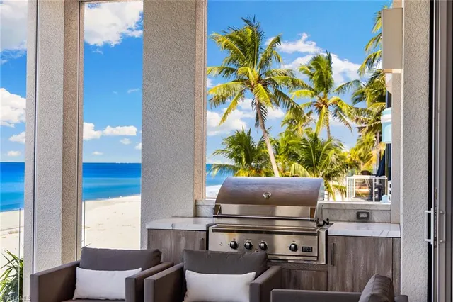 a living room with a couch and a potted plant
