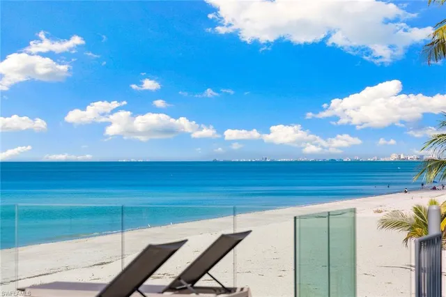 a view of a backyard with sitting area