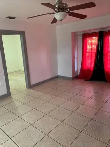 a view of a livingroom with a furniture and a window