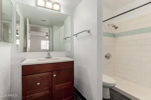 a bathroom with a sink and mirror