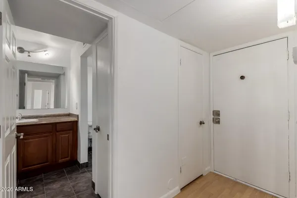 a bathroom with a sink double vanity and toilet