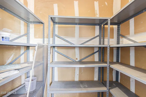 a view of a house with a yard and large tree