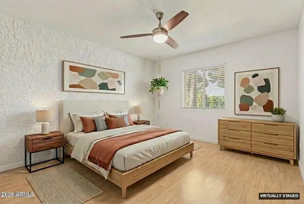 a bedroom with a bed furniture and decor