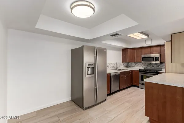 a view of empty room with ceiling fan