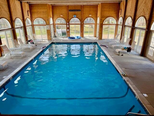 42 Eventide Lane Hyannis, MA 02601 - Photo 33 of 39 a view of a swimming pool with a lounge chair