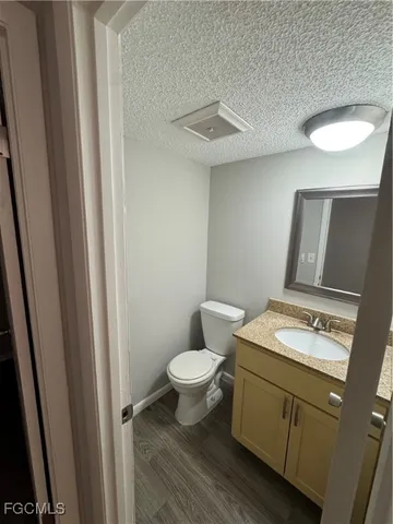 a bathroom with a toilet and a sink