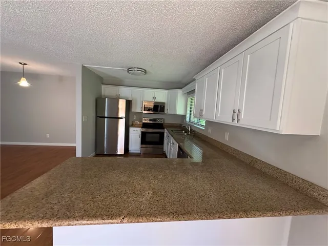 a view of a kitchen with a sink
