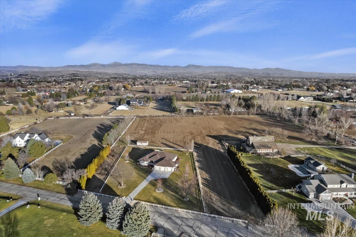 3366 North Croft Way Eagle, ID 83616 - Photo 20 of 33 Aerial perspective of suburban area with mountains