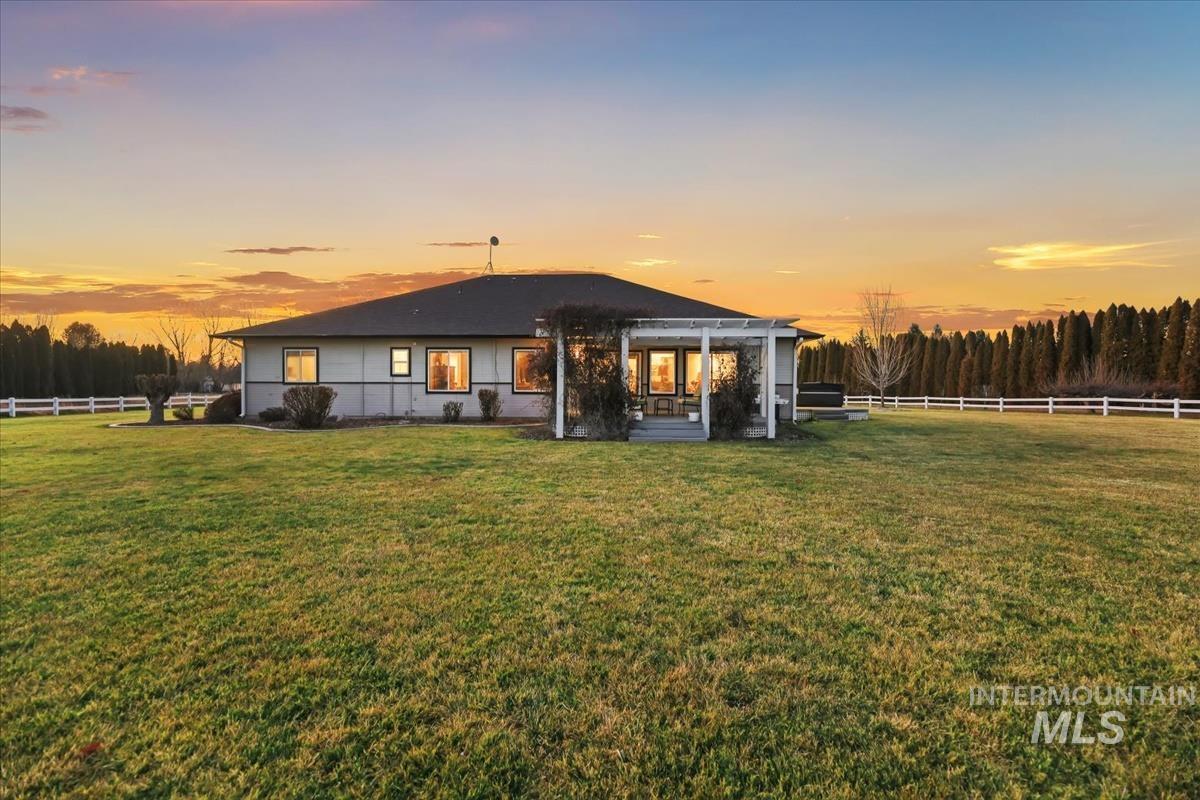 3366 North Croft Way Eagle, ID 83616 - Photo 22 of 33 Back of property at dusk with a patio area