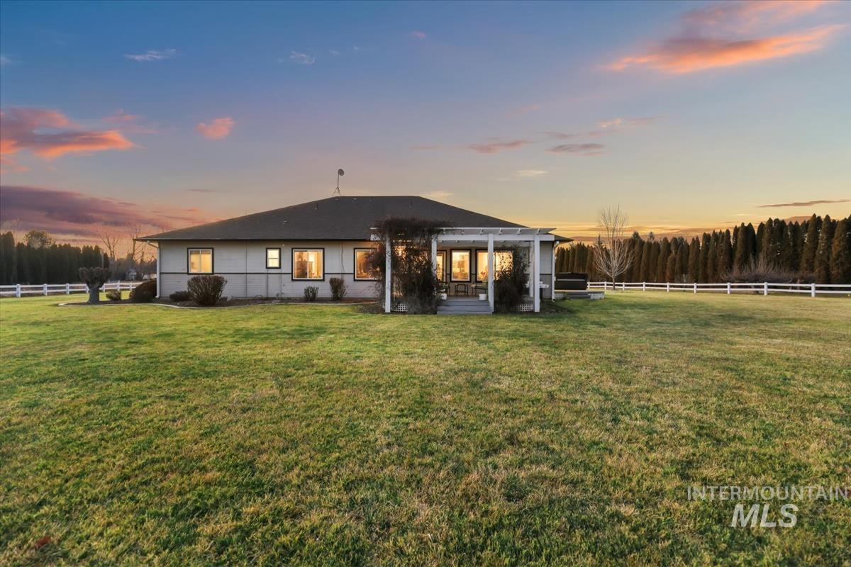 3366 North Croft Way Eagle, ID 83616 - Photo 25 of 33 Back of property at dusk with a patio area