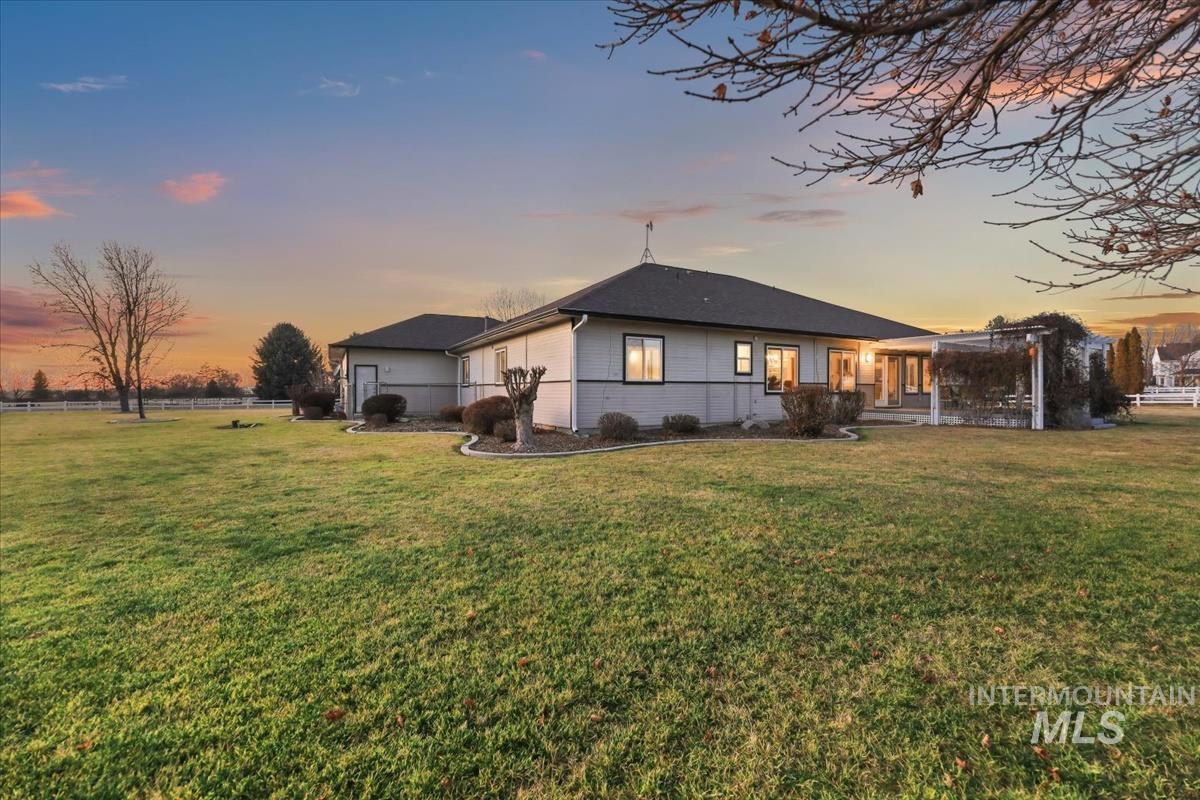 3366 North Croft Way Eagle, ID 83616 - Photo 28 of 33 Back of property featuring a yard and a patio area