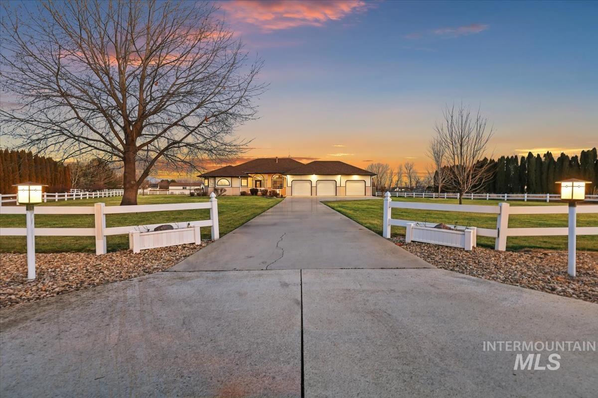3366 North Croft Way Eagle, ID 83616 - Photo 3 of 33 Ranch-style home featuring a fenced front yard, driveway, and a garage