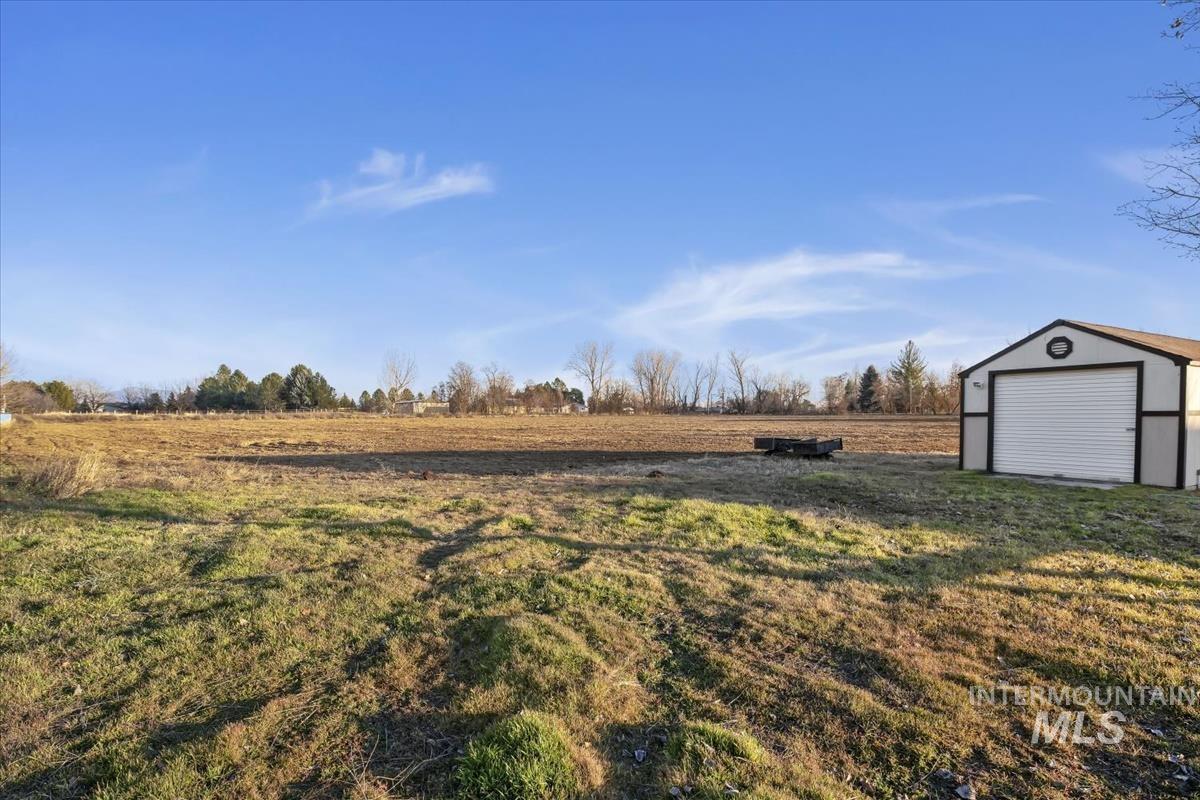3366 North Croft Way Eagle, ID 83616 - Photo 7 of 33 View of yard featuring an outbuilding and a view of rural / pastoral area