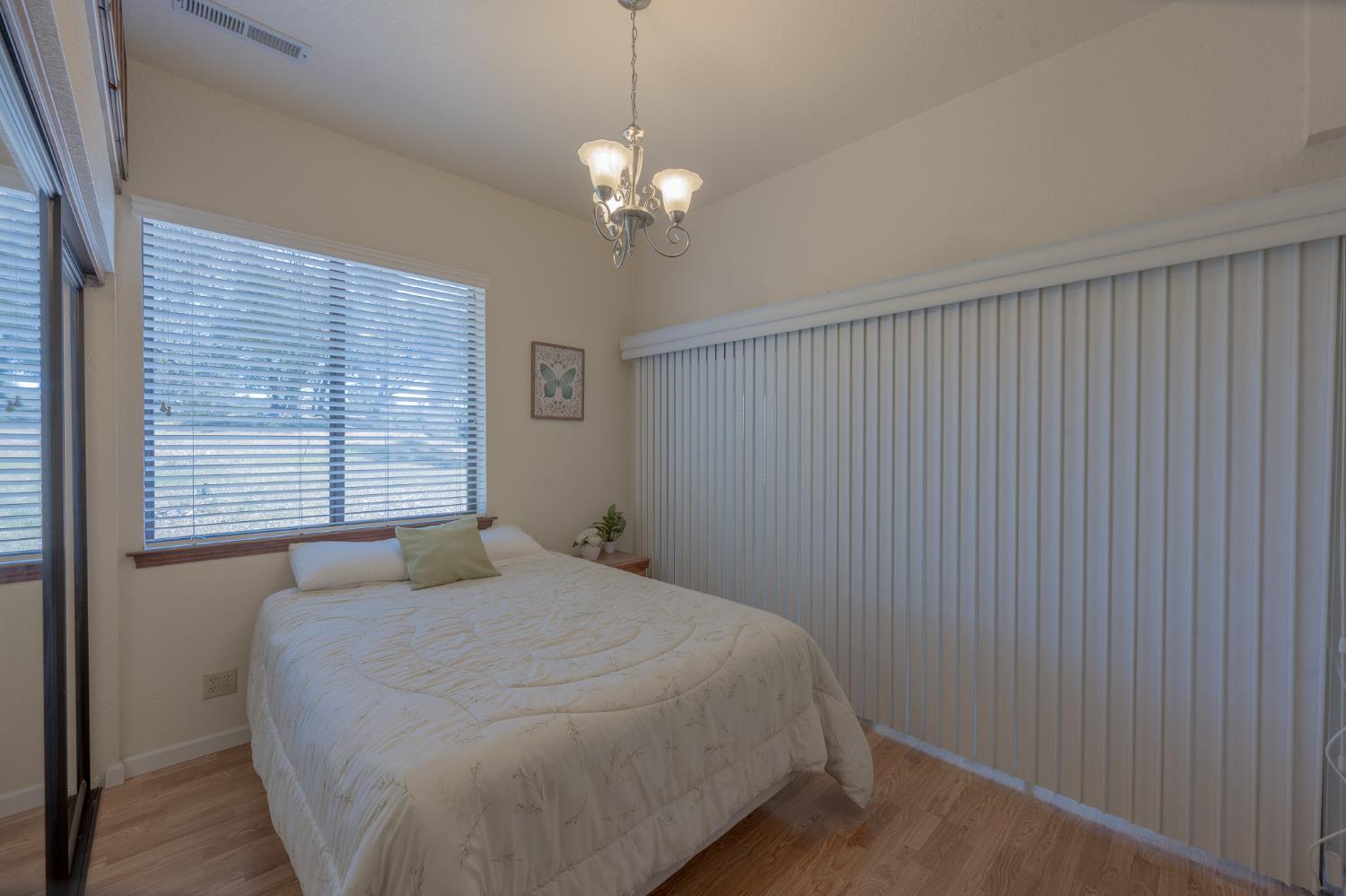 5912 Old Gulch Road San Andreas, CA 95249 - Photo 16 of 71 a bedroom with a bed and a window