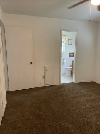 a view of an empty room and a sink