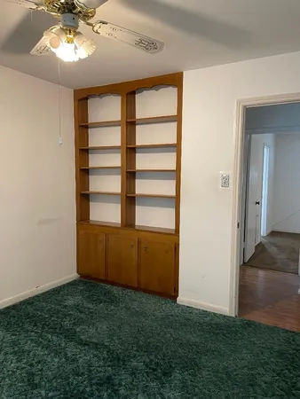 a view of room with workspace and a window