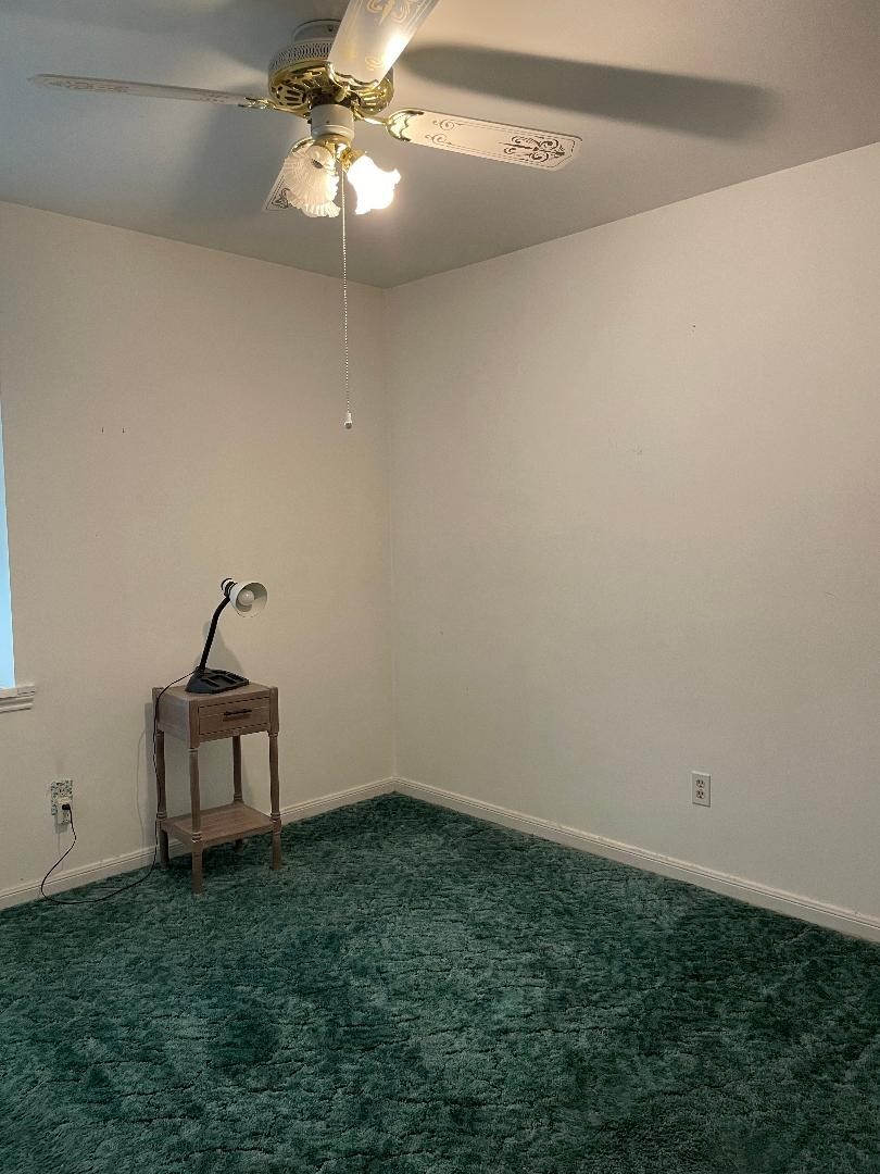 1733 Brumbelow Street Rosenberg, TX 77471 - Photo 22 of 36 a view of a room with a fan and a window