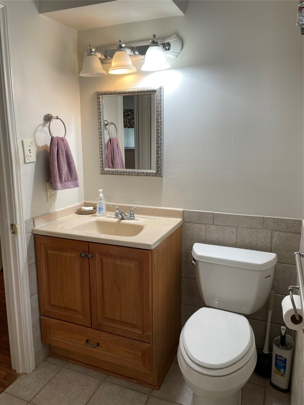 1733 Brumbelow Street Rosenberg, TX 77471 - Photo 25 of 36 a bathroom with a toilet sink vanity and mirror