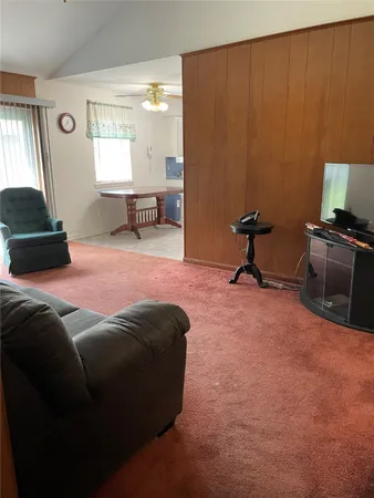 a bed room with a bed and a chair