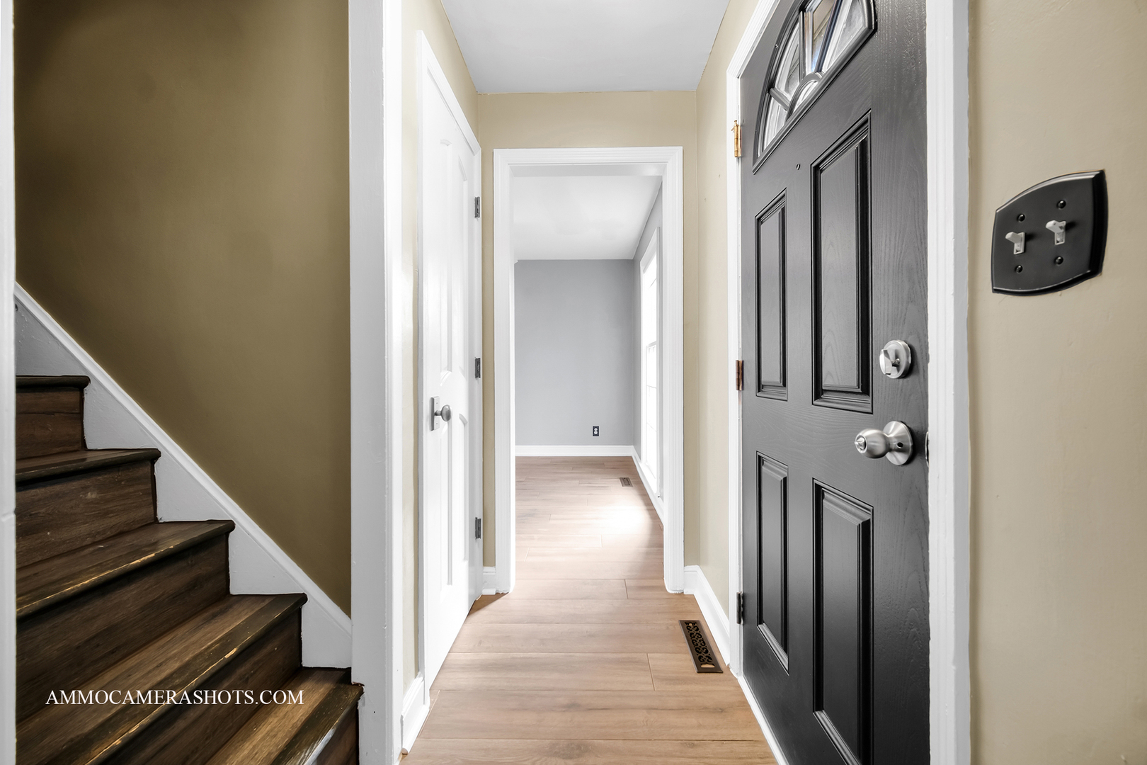 515 Miller Drive Elgin, IL 60123 - Photo 4 of 27 a view of a hallway with wooden floor and staircase