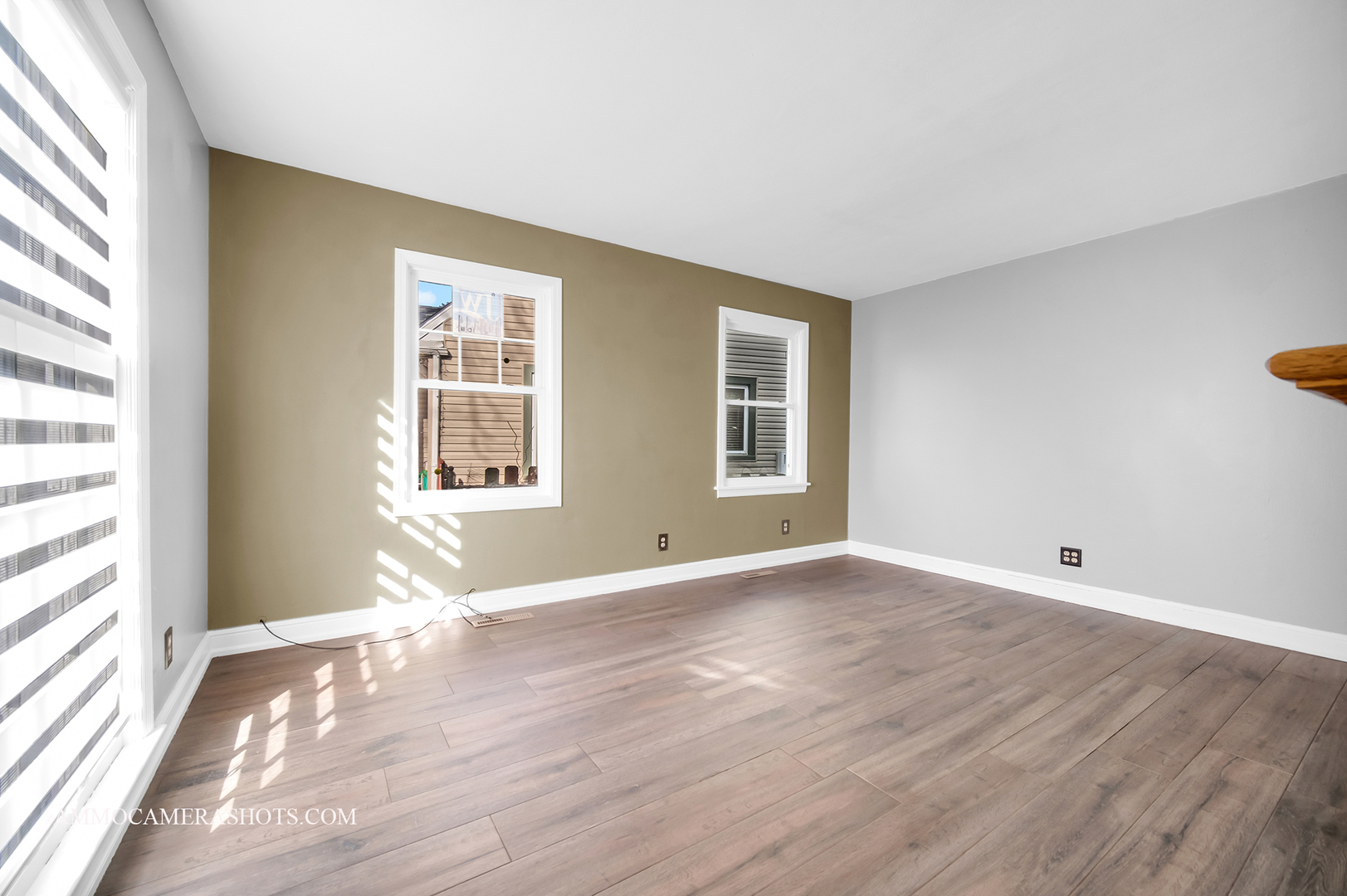 515 Miller Drive Elgin, IL 60123 - Photo 5 of 27 a view of an empty room with wooden floor and a window