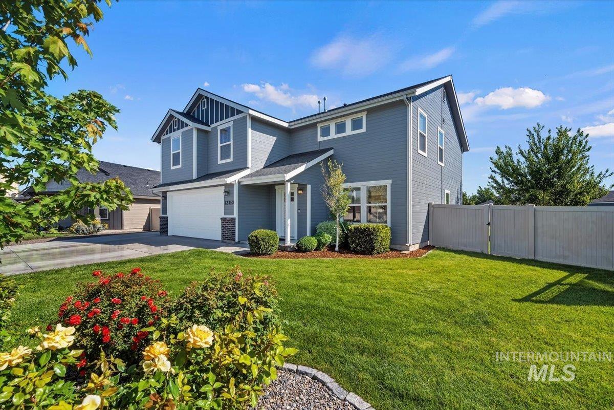 12310 West Hidden Point Drive Star, ID 83669 - Photo 32 of 48 Contemporary two-story residence featuring grey siding with white trim accents and a dark shingle roof