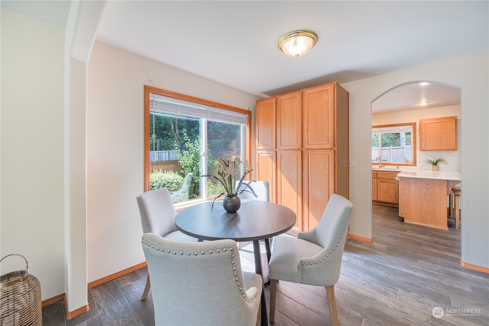 20014 34th Avenue Southeast Bothell, WA 98012 - Photo 7 of 22 a view of a dining room with furniture window and wooden floor