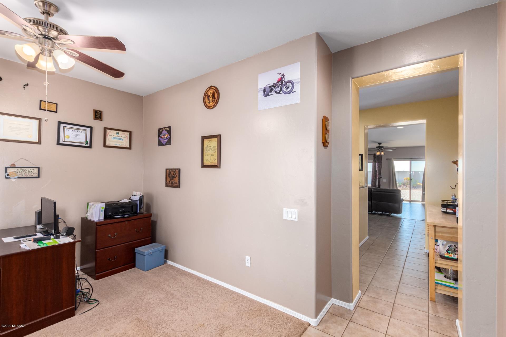21203 East Reunion Road Red Rock, AZ 85145 - Photo 4 of 26 a bedroom with a workspace