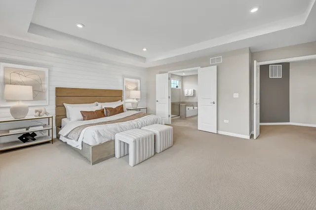 a bedroom with a bed and a night stand